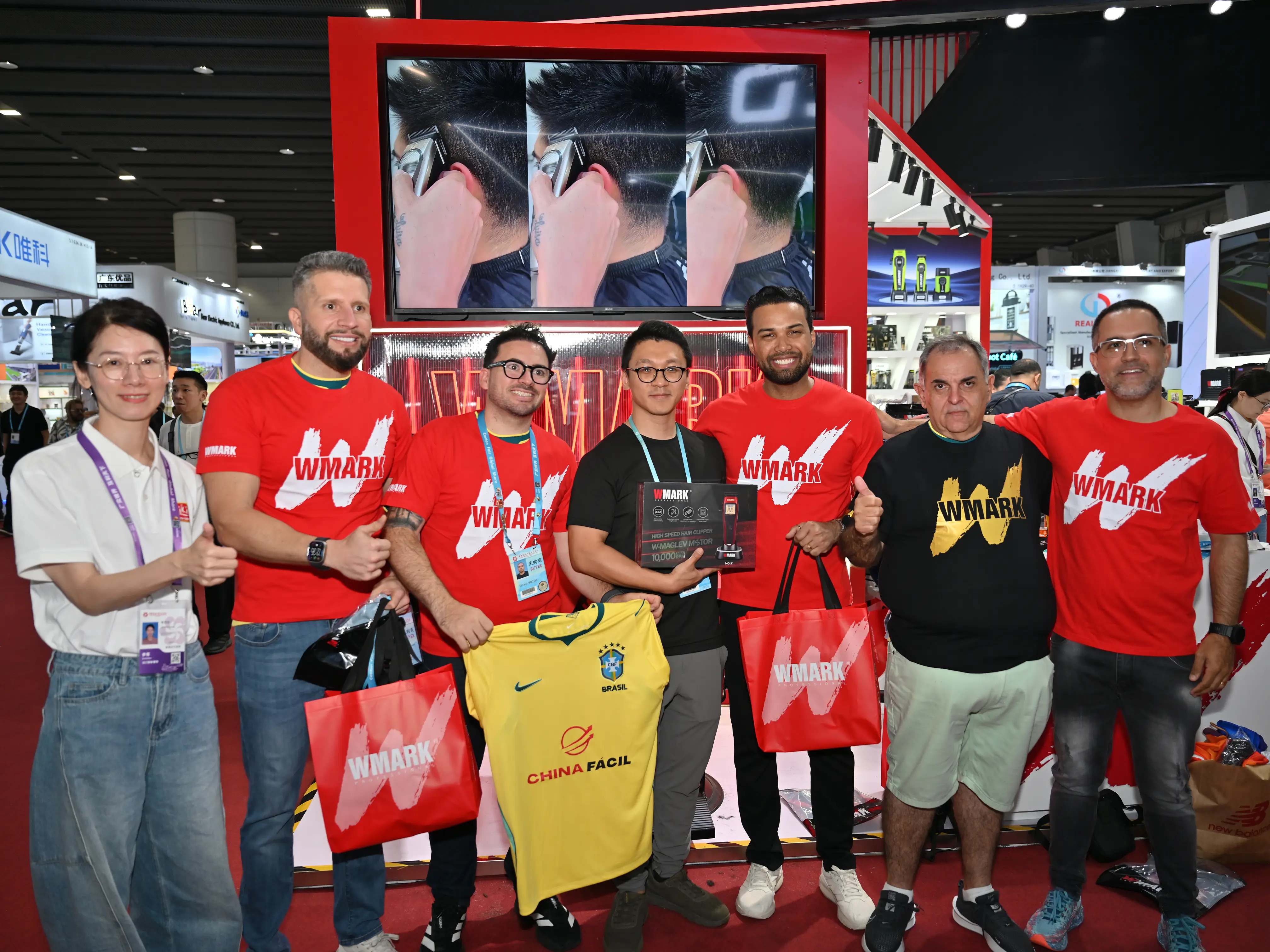 International visitors explore and interact with WMARK barber tools at the 139th Canton Fair 2026, highlighting product engagement and hands-on experiences.