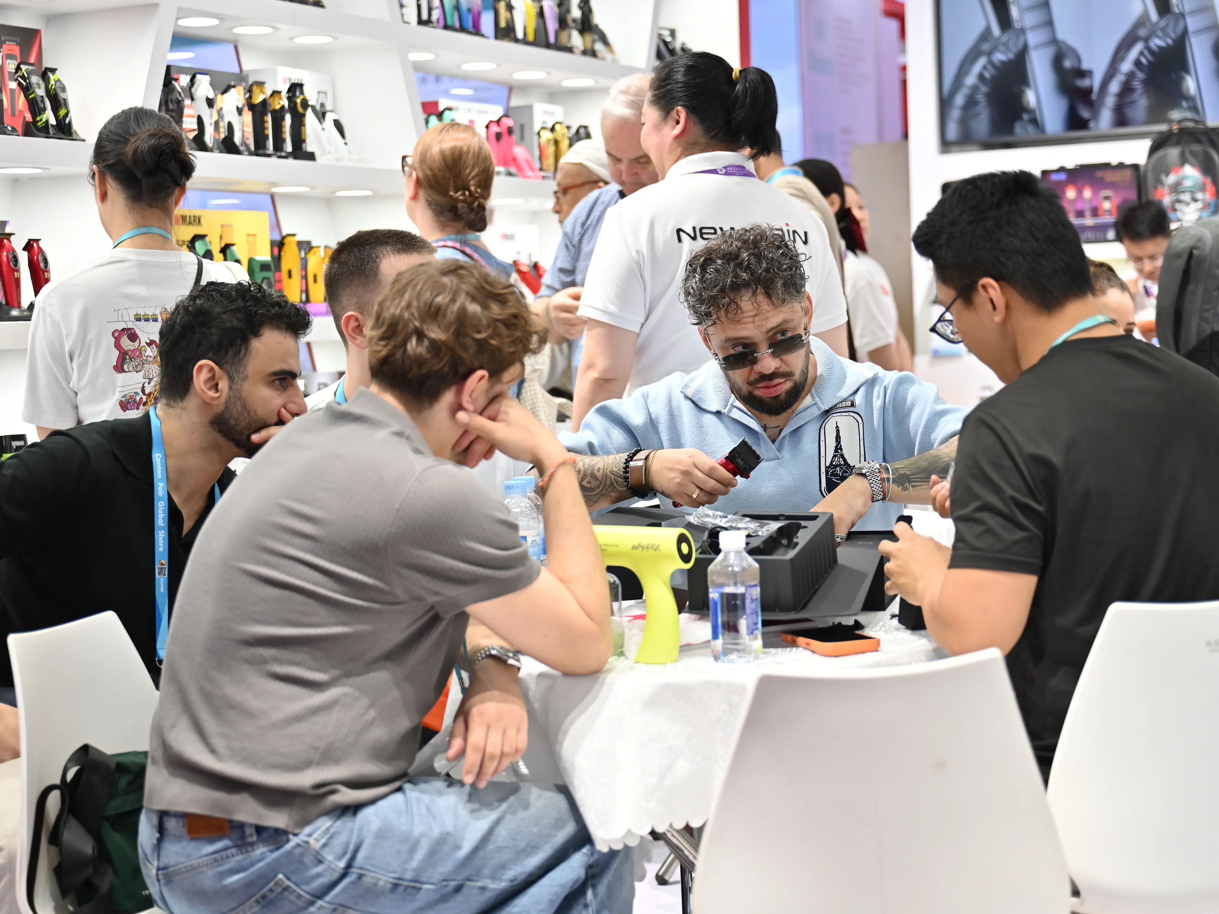 WMARK team and customers celebrating at the 139th Canton Fair 2026 with product giveaways, featuring a dynamic brand atmosphere.